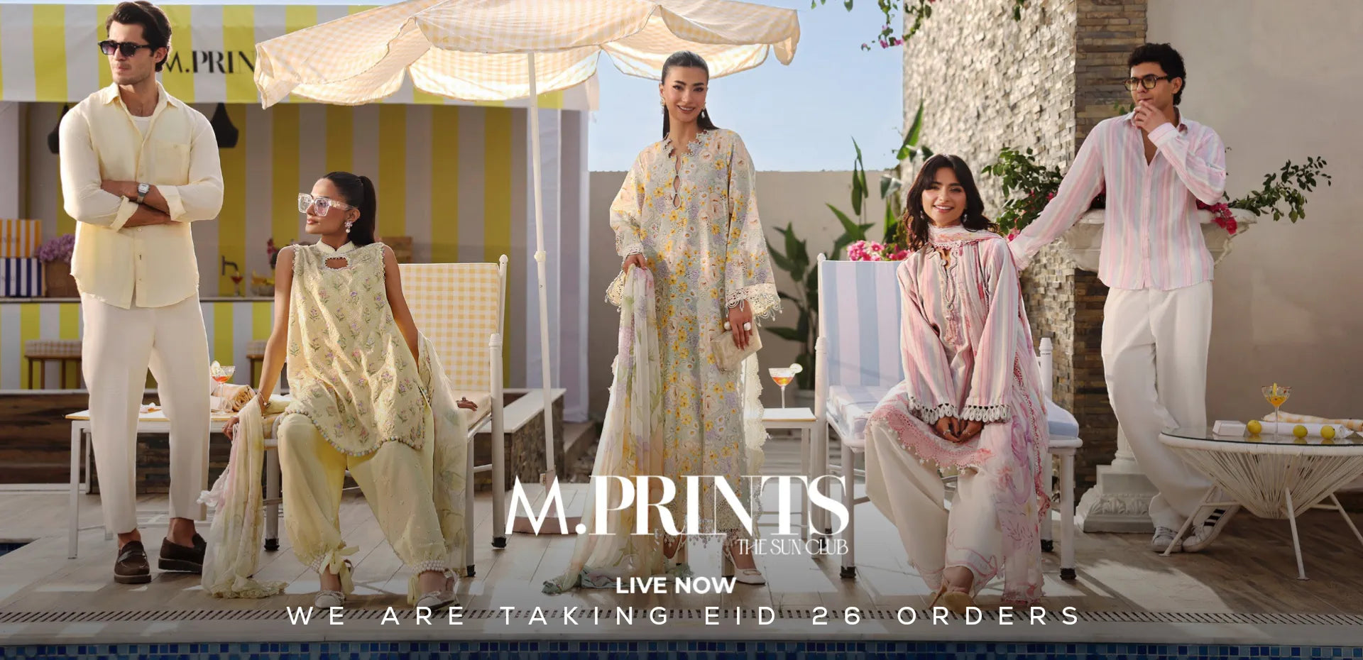 Promotional image of a fashion brand Maria B with models in outdoor setting, featuring 'M. Prints' branding Eid Dresses UK.1621243260e1af0c20-0