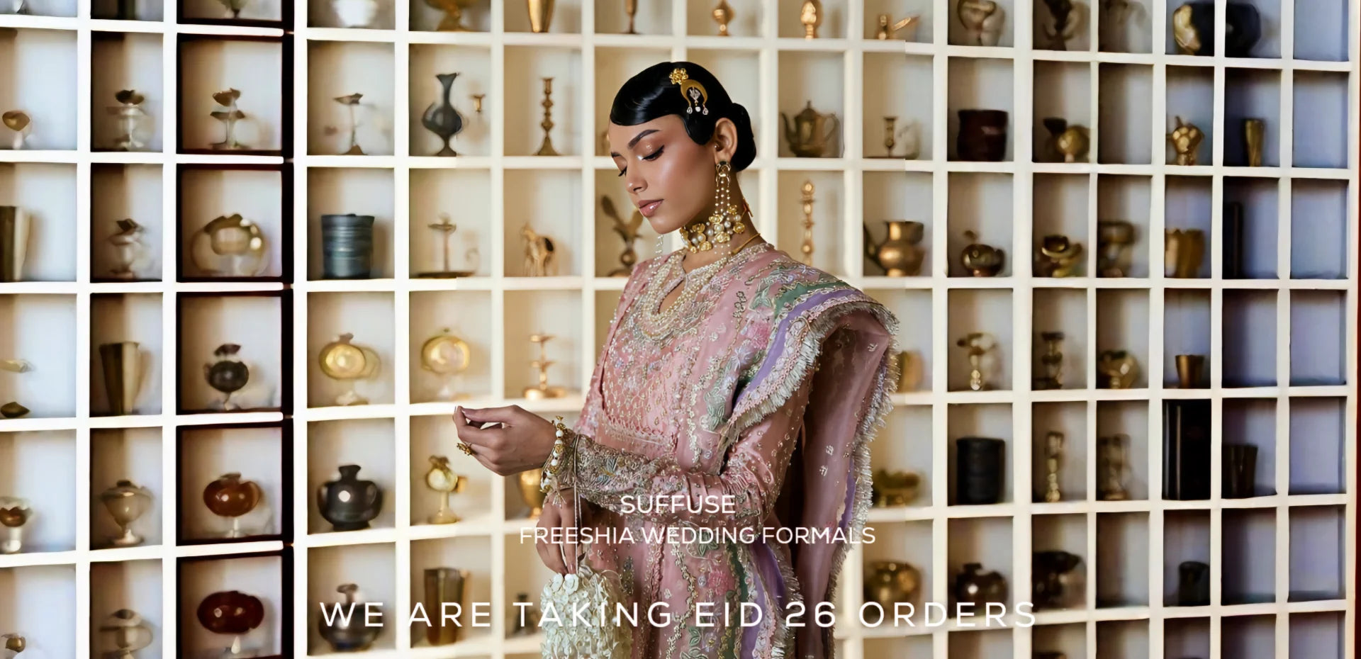Woman in traditional attire with jewelry against a shelf background, featuring 'Suffuse' branding.1621243260e1af0c20-1